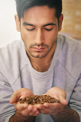 Image showing Man, holding coffee beans and production with smell, thinking and organic grain for export at warehouse. Person, employee and crop for manufacturing, industry and factory for aroma test in Colombia