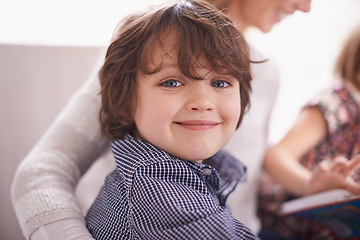 Image showing Smile, portrait and boy child on sofa with mom for bonding, support and fun together in home. Story, mother and face of kid on couch for family development, relax and happy children in living room