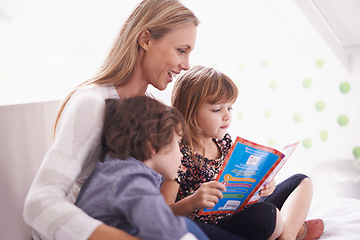 Image showing Reading, mother and children on sofa with story for bonding, teaching and learning together in home. Woman, son and daughter relax on couch with storytelling book, smile and happy family in house