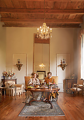 Image showing Noble, couple and luxury with food, dinner and renaissance home or house and dining table. King, queen and palace with royal feast, rich meal and wealthy monarch or ruler with tudor era supper