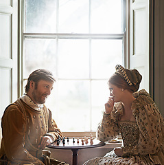 Image showing Cunning move indeed mlady. Shot of a an aristocratic couple playing chess.