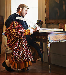 Image showing Man, aristocrat and writing with quill in book for renaissance, royalty aesthetic and letter in palace. Monarch, wealthy person and elegant clothes for cosplay, regal or communication in castle