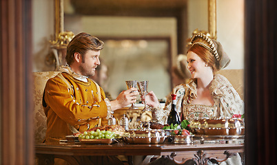 Image showing Royal, man and woman with luxury for dinner, wine and toast together for wedding and coronation. King and queen with smile for food with alcohol to drink in palace, happiness and joy for marriage