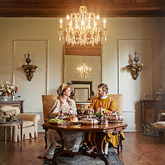 Image showing Noble, couple and luxury with food, feast and renaissance home or house and dining table. King, queen and palace with royal dinner, rich meal and wealthy monarch or ruler with tudor era supper