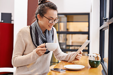 Image showing Woman, coffee shop and tablet with freelancer job and social media in cafe with cappuccino. Website, hot drink and internet with digital blog writer and technology at restaurant with tea and reading