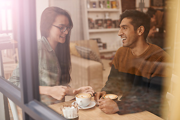 Image showing Coffee shop, date and and couple with drink in conversation, talking and chatting for bonding. Love, happy and man and woman with caffeine, cappuccino and beverage in restaurant, cafe and store