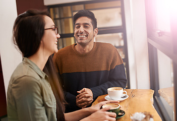 Image showing Coffee shop, happy and couple laugh with drink in conversation, talking and chatting for bonding. Love, morning and man and woman with caffeine, cappuccino and beverage in restaurant, cafe and store