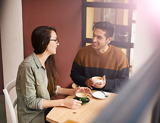 Image showing Coffee shop, morning and couple on date with drink in conversation, talking and chatting for bonding. Love, happy and man and woman with caffeine, cappuccino or beverage in restaurant, cafe and store