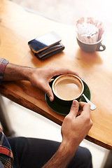 Image showing Man, hands and coffee with breakfast for drink, caffeine or morning beverage at indoor restaurant. Closeup of male person with mug or cup of latte, cappuccino or espresso on desk or table at cafe