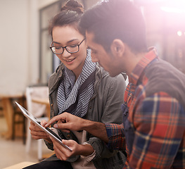 Image showing Students, discussion and browsing with tablet at cafe for project or planning at indoor restaurant. Man, woman or friends on technology for online research, collaboration or networking at cafeteria