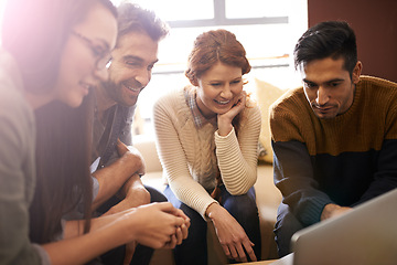 Image showing Happy team, meeting and planning with laptop at cafe for discussion or creative project. Group of people, employees or friends with technology for brainstorming or startup at coffee shop or lounge