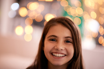 Image showing Home, happy and portrait of child with in bedroom for relaxing, resting and calm at night. Youth, smile and face of young girl with fairy lights for childhood memories, positive and happiness