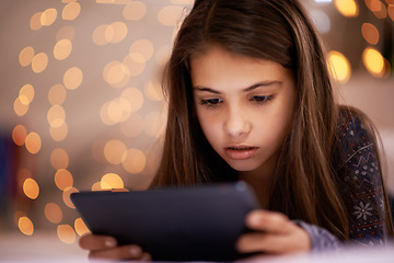 Image showing Home, night or girl with tablet for streaming, playing games or watching videos on a movie website. Internet, house or female child with technology to download online or social media app to relax