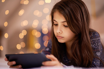 Image showing Night, bedroom or child with tablet for streaming, playing games or watching videos on a movie website. Research, house or female kid with technology to download online or social media app to relax