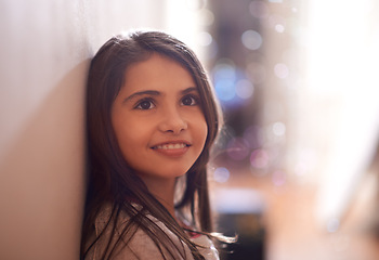 Image showing Happy, thinking and face of child in home for relaxing, rest and calm on weekend in bedroom. Youth, smile and young girl for wondering, contemplate and thoughtful for happiness, playing and childhood