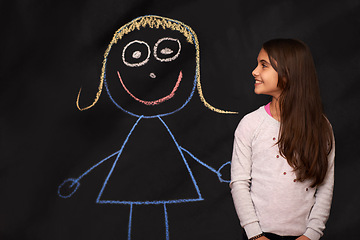 Image showing Blackboard, children and girl with chalk art, drawing or picture of imaginary friend on dark background. Fantasy, creative or kid person with companion sketch, dream or school, homework or assignment