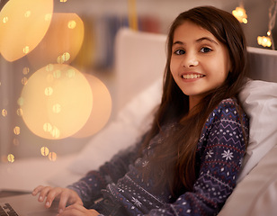 Image showing Portrait, night or kid with laptop for streaming, playing games and watching videos on a movie website. Smile, house or happy child with technology to download online or social media app to relax