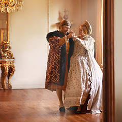 Image showing Renaissance, man and woman dance in castle together with vintage love, romance and banquet performance. Medieval king, queen or royal couple in ballroom holding hands with smile in palace in Europe