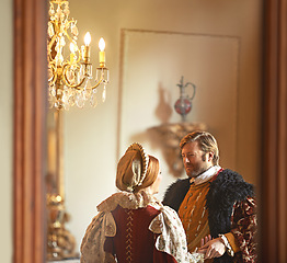 Image showing Victorian, man and woman talking in royal castle together with vintage love, romance and banquet hall. Medieval king, queen or renaissance couple in ballroom holding hands with conversation in palace