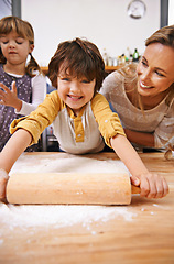 Image showing Mother, children and rolling pin with dough in kitchen for pizza, young and growing up for adolescent and family. Mom, kids and smile with flour for food and roll for fun, bonding and joy in holiday