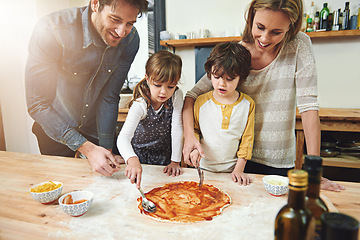 Image showing Parents, kids and happy for cooking pizza with sauce, learning and helping hand for development in kitchen. Mother, father and children with dough, teaching and support with bonding in family house
