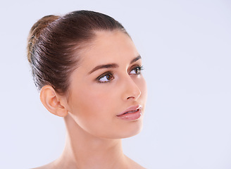 Image showing Beauty, skincare and woman with confidence, thinking and benefits of facial cosmetics in studio. Dermatology, health and face of girl with natural makeup, glow and skin care on white background