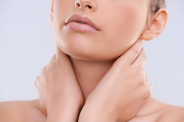 Image showing Hands, face and mouth with woman for beauty, makeup with shine and cosmetics on white background. Skin, lipstick or balm for lips moisturizer, skincare and glow for wellness with closeup in studio