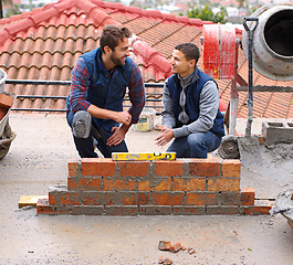 Image showing Construction worker, bricklayer and men building a brick wall, handyman or contractor with trade for mentor and apprentice. Team, builder and cement with tools, maintenance renovation for training