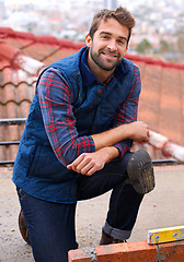 Image showing Bricklayer, smile and construction with man builder on roof, working employee in industrial industry and contractor career. Confident, happy male person on rooftop or handyman renovation on house