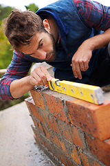 Image showing Man, spirit level and construction for bricklayer, working employee in industrial industry and contractor career. Serious, male person and balance tool or handyman for renovation on building project