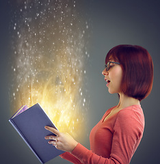 Image showing Profile, glowing book and woman with creativity, story and education on grey studio background. Person, model and girl with novel or literature with knowledge or learning with light, magic or fantasy