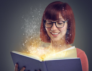 Image showing Glowing pages, book or woman with a story, glasses or education on grey studio background. Person, reader or girl with a novel or literature with knowledge or eyewear with fantasy, smile or astrology