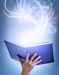 Image showing Hand, person and magic with book, fantasy and sparkle with education on a blue studio background. Model, closeup and reader with literature and knowledge with learning and creativity with glitter