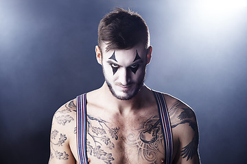 Image showing Man, mime and topless for theatre performance with dark background with light for stage, creativity and entertainment. Portrait, circus or magician performer and face paint with tattoo for show