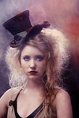 Image showing Face, woman and theatre as actress with smoke for musical with creative makeup for entertainment, artist and fashion. Portrait, female person and outfit for performance, rehearsal in dark background