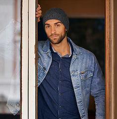 Image showing Man, portrait and winter fashion in house, window and hipster with serious male person standing in warm clothes. Beanie, head wear for comfort, indoor and cool denim jacket for manly trends in Canada