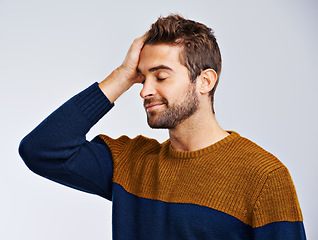 Image showing Happy man, mistake and regret with anxiety, failure or embarrassed on a white studio background. Male person or model in disappointment, emotion or ashamed reaction for decision or choice on mockup