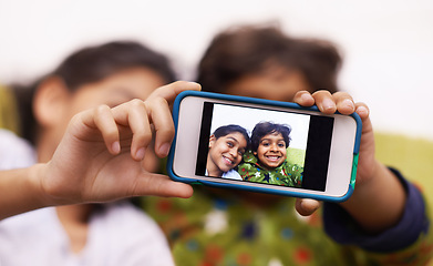 Image showing Phone screen, photography and kid siblings on a floor for fun, vacation or memory at home from above. Smartphone, selfie and children in a living room smile for social media, blog or profile picture