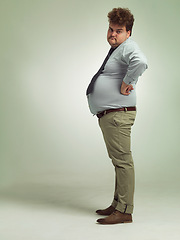 Image showing Business man, portrait and plus size with unhappy, sad and frustrated in studio with arms on hips. Job, employee and office fashion with problem and clothing with green background and moody from work