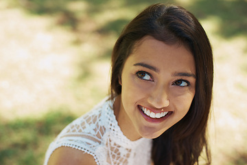 Image showing Woman, smile and relaxing in park or garden, satisfaction and joyful on summer holiday. Female person, peace and enjoying vacation in countryside, outdoors and calm on weekend adventure in nature