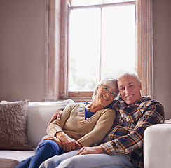 Image showing Elderly couple, smile and portrait on sofa for family, retired and relax for break or rest on mockup. Pensioners and hugging with happiness for embrace, love and comfort on couch in house for unwind
