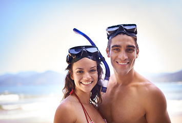 Image showing Scuba diving, portrait or couple on holiday at a beach to explore for marine adventure, hobby or vacation activity. Mask, divers or people at sea for travel, tropical environment or outdoor nature
