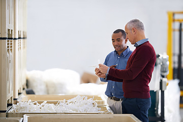 Image showing Factory, communication and warehouse inspection of raw materials and quality assurance of stock. Business people, discussion and diversity on site, collaboration and decision on inventory in shelf