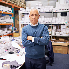 Image showing Portrait, man and confident by shelves in distribution warehouse and pride in career as inspection of stock. Mature face, professional or arms crossed in job or administration of inventory on site