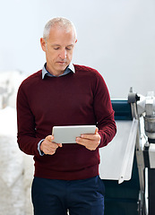 Image showing Tablet, retail and senior businessman at a warehouse for stock, cargo or quality control inspection. Ecommerce, supply chain or male factory manager with logistics app, planning or procurement search