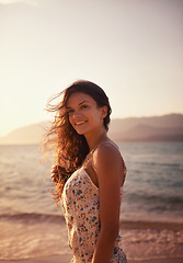 Image showing Happy woman, thinking at beach and travel for ocean, view and vacation in Cancun with nature, sunset and breeze. Fresh air, wellness and reflection outdoor, smile for adventure and tourism on island