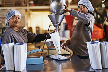 Image showing Business, women and coffee beans packaging in factory with portrait, smile and manufacturing teamwork. Production, people or employee with bags, weighing tool and supply chain industry in warehouse