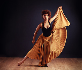 Image showing Contemporary, dancer and woman for dancing in studio with performance, training or practice lesson for art. Black person, skirt or choreographer routine with movement, passion or skill for expression