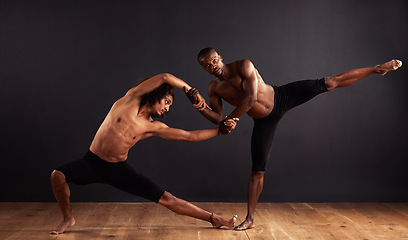 Image showing Performance, theatre and moving of men for dance, creative and art of body, team and passion. Black background, male people and partners with pride, confident and balance for ballet and stage