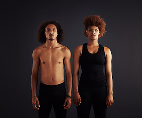 Image showing Dancer, couple and portrait for creative and contemporary art on stage for performance. African man and woman and serious for art deco in theater for ballet or jazz on dark background in studio